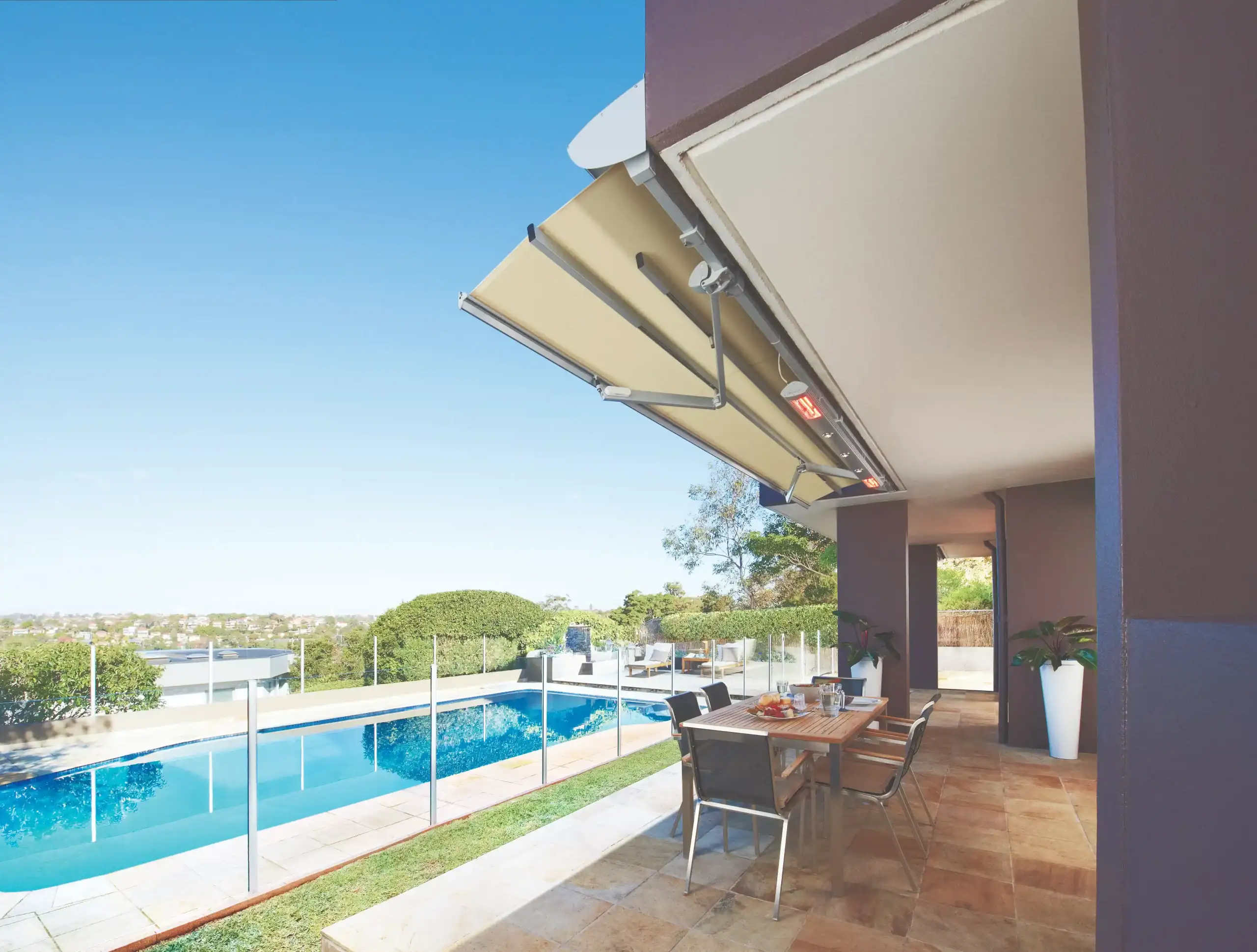 Retractable outdoor awning shading a patio with pool view in Sydney.
